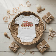 Firefighter Baby Outfit, Engine Co. Cutie Onesie®, First Responder Shower Gift, Baby Shower Gift, Fireman Baby Reveal, Fireman Baby Theme. Your little hero just rolled onto the scene! This “Engine Co. Cutie” onesie is the perfect outfit for firefighter families and first responder parents who want to celebrate their newest recruit. The cozy fit and vintage firetruck design make it a heartwarming baby shower gift or everyday outfit for your brave little cutie.