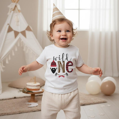 Lumberjack First Birthday Shirt • Wild One Outfit Boy • Buffalo Plaid Birthday Shirt • Woodland 1st Birthday • Family Matching Lumberjack. This soft, high-quality tee or onesie is ideal for cake smash photos, woodland birthday themes, camping-style parties, or classic lumberjack first birthday celebrations. The modern, neutral party setup pairs beautifully with your child’s milestone photos. Available for babies, toddlers, kids, and matching family sets so everyone can join the Wild One fun.