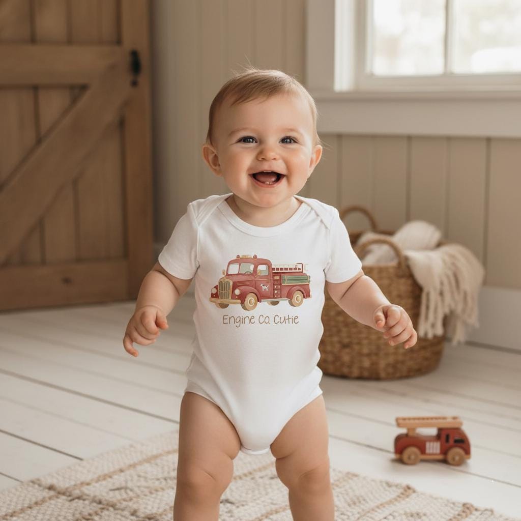 Firefighter Baby Outfit, Engine Co. Cutie Onesie®, First Responder Shower Gift, Baby Shower Gift, Fireman Baby Reveal, Fireman Baby Theme. Your little hero just rolled onto the scene! This “Engine Co. Cutie” onesie is the perfect outfit for firefighter families and first responder parents who want to celebrate their newest recruit. The cozy fit and vintage firetruck design make it a heartwarming baby shower gift or everyday outfit for your brave little cutie.
