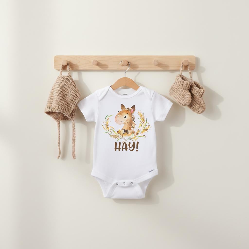 "Hay”  This cute and funny country theme baby bodysuit or t-shirt is sure to make your loved ones smile!  It features an adorable hand-drawn style horse with the word "Hay!" Such a cute play on words!  Makes a great baby shower gift!  Perfect for the newest little cowgirl or cowboy in your life!