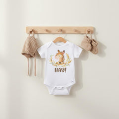 "Hay”  This cute and funny country theme baby bodysuit or t-shirt is sure to make your loved ones smile!  It features an adorable hand-drawn style horse with the word "Hay!" Such a cute play on words!  Makes a great baby shower gift!  Perfect for the newest little cowgirl or cowboy in your life!