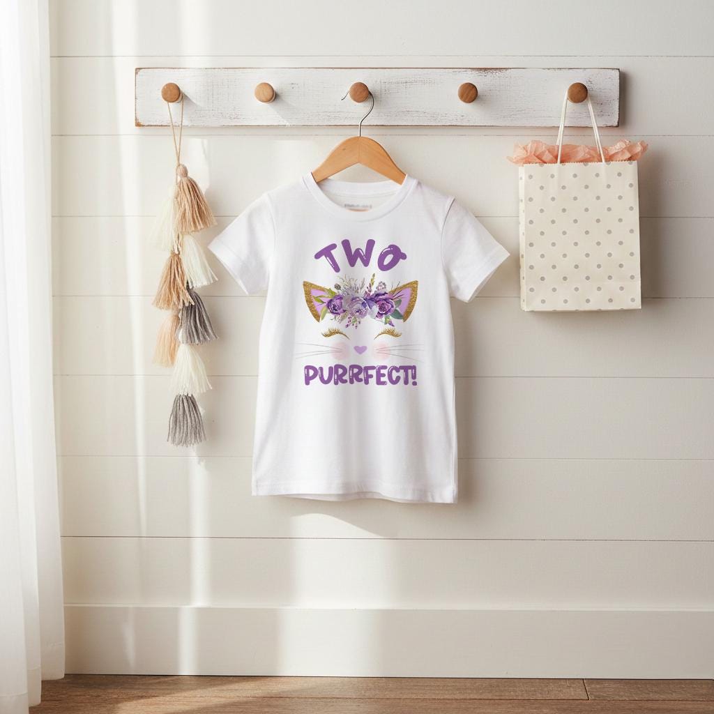 Celebrate your little girl's second birthday party in style with our "Two Purrfect" kids tee! It's the purr-fect choice for the occasion, featuring an utterly adorable kitten face and the oh-so-purrfect phrase that'll make her giggle with delight. Whether she's twirling with excitement or enjoying a slice of cake, this tee will keep her comfy and cute throughout her special day. with "Two Purrfect," your birthday girl is sure to spread twice the joy and feline