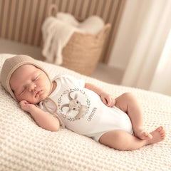 Boho watercolor Capricorn baby onesie design featuring a soft beige baby goat with curved horns and gentle botanical sprigs. Earthy neutral colors create a unisex look perfect for December and January babies. Bright white background, clean edges, high-quality printable zodiac illustration ideal for baby shower gifts, newborn outfits, and astrology-themed milestone photos.