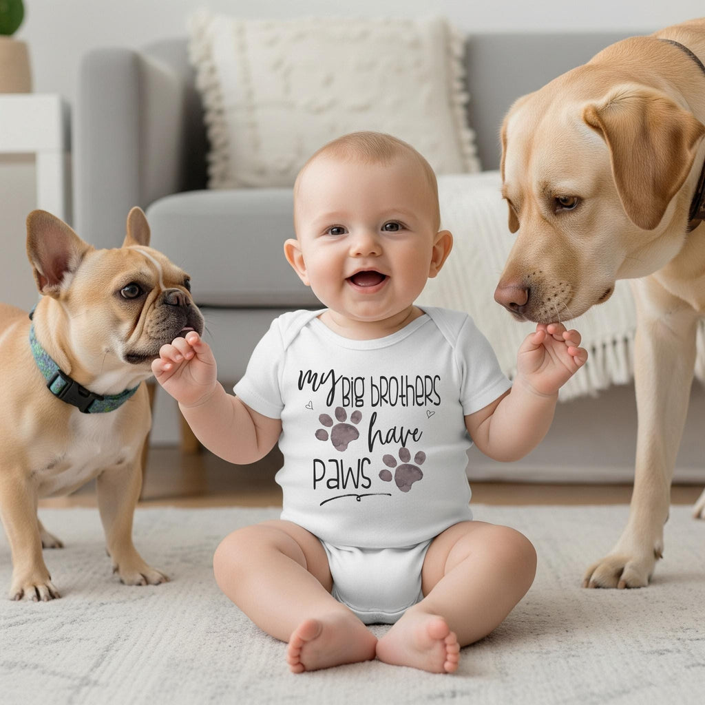 "My Big Brothers Have Paws”  This adorable unisex design features the words "My big brothers have paws" in fun fonts with two watercolor style paw prints. Perfect pregnancy reveal to all family, especially grandparents, and for maternity photoshoots!  Also super cute for social media pregnancy announcements!  Once the baby is born, he or she will look adorable wearing this design in photos with their fur babies.  Makes a great baby shower gift for the animal loving family!